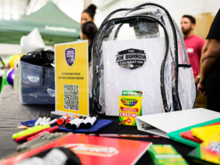 GS_0245 The Joe Burrow Foundation backpack and school supplies on a table at The Joe Burrow Foundation's second-annual Burreaux's Back-to-School Kickoff.