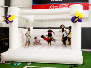 GS_0309 Children playing inside of an inflatable jumper at The Joe Burrow Foundation's second-annual Burreaux's Back-to-School Kickoff.