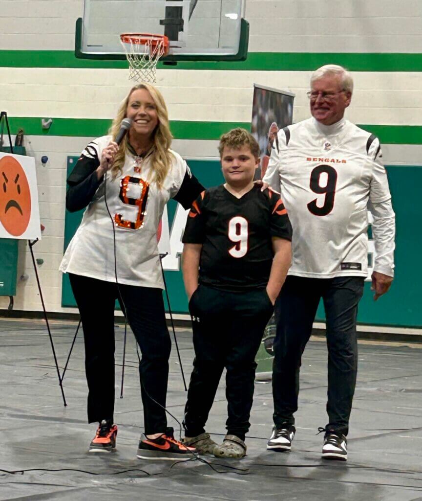 eastern_local_elementary_HBHM_robin_jimmy_boy Robin Burrow and Jimmy Burrow with a boy at The Joe Burrow Foundation's Healthy Body, Healthy Minds event at Eastern Local Elementary School.